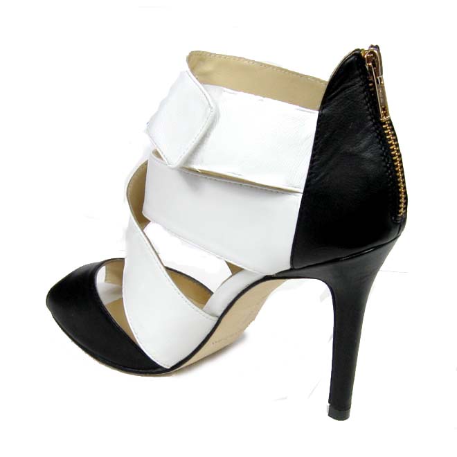 Manolo Blahnik black and white back slide fastener pumps